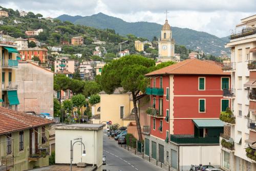 a city street with buildings and a clock tower at Domus Portofino - Relax & Live the Italian Riviera in Santa Margherita Ligure