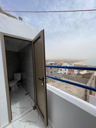 an open bathroom with a toilet on a balcony at Adar guest house in Agadir