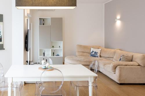 a living room with a couch and a table at Domus Portofino - Relax & Live the Italian Riviera in Santa Margherita Ligure