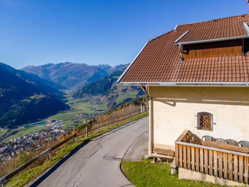 a house on a hill with a view of a valley at Obervellach in Obervellach