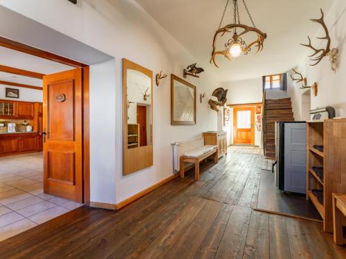 a large living room with wooden floors and a chandelier at Obervellach in Obervellach