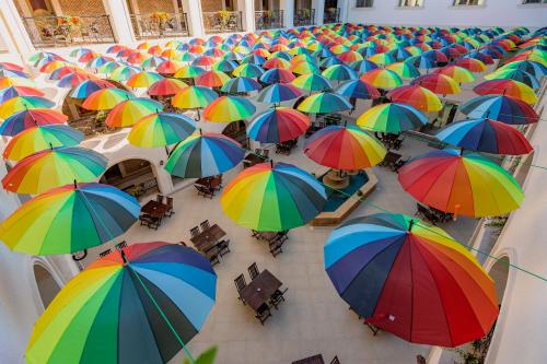 an overhead view of a bunch of colorful umbrellas at Gabala Karvansaray Hotel in Gabala