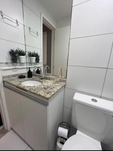 a white bathroom with a sink and a toilet at varandasdofrancesapt216 Praia do Frances in Praia do Frances