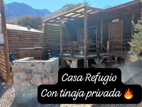 a house with a fire in front of it at Casa Refugio en Rivadavia in Vicuña