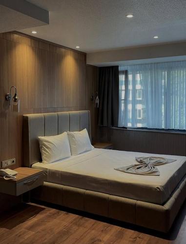 Ένα ή περισσότερα κρεβάτια σε δωμάτιο στο Volonte Hotel & Spa