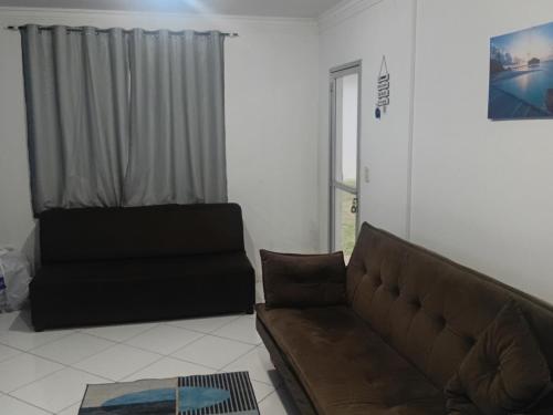 Ruang duduk di Apartamento 101 com vista da piscina e mar
