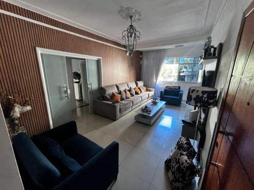 an aerial view of a living room with a couch at Farol da Barra express - suítes in Salvador