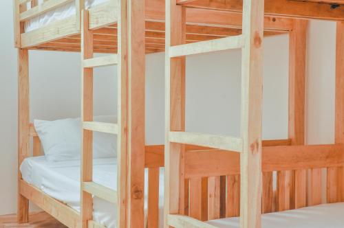 a bunk bed room with two bunk beds at Kampupot Beach Houses in Lemery
