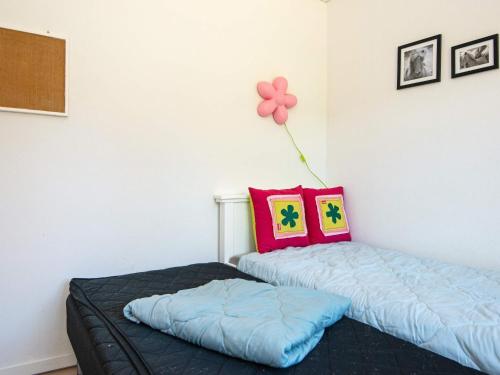 a bedroom with two beds and a balloon on the wall at 6 person holiday home in Nordborg-By Traum in Nordborg