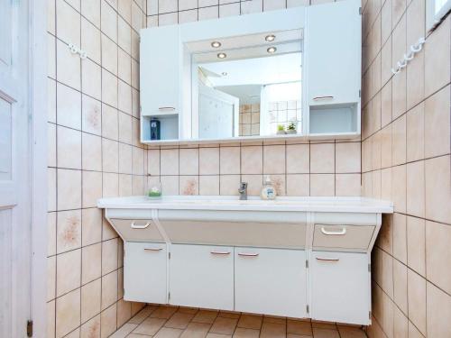 a bathroom with a white sink and a mirror at 6 person holiday home in Nordborg-By Traum in Nordborg