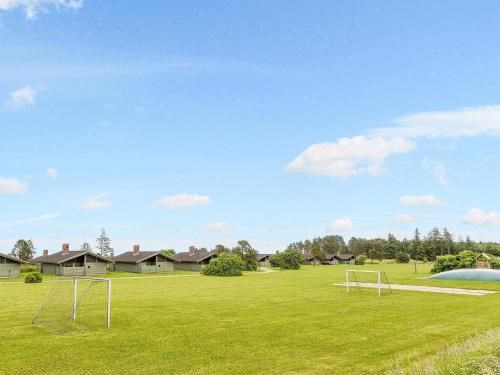 a soccer field with two goal posts in the grass at Vigsø Holiday Center in Hanstholm