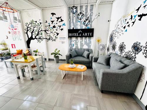 a living room with two couches and a table at Hotel y Arte Antigua by Amazing Guatemala Travel in Antigua Guatemala