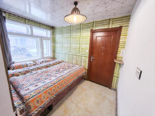 Ένα ή περισσότερα κρεβάτια σε δωμάτιο στο Snow Valley Breeze Inn