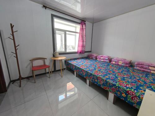 Ένα ή περισσότερα κρεβάτια σε δωμάτιο στο Snow Valley Breeze Inn