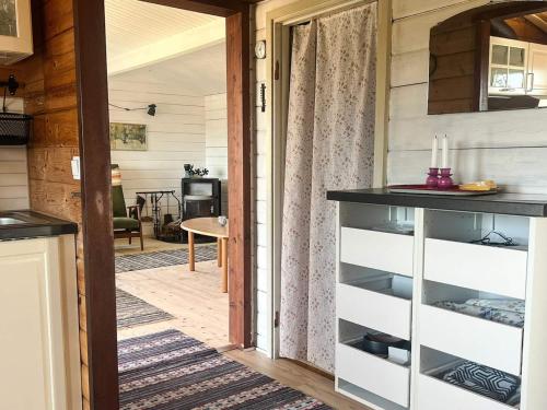 a room with a door leading to a living room at 6 person holiday home in RÖRVIK in Rörvik