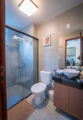 a bathroom with a toilet and a sink and a shower at Casa 12 do Paraíso - Atins in Atins