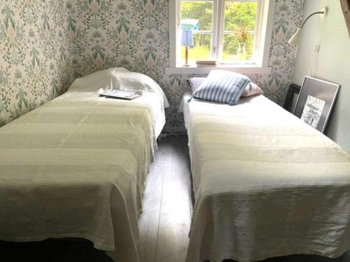 Ένα ή περισσότερα κρεβάτια σε δωμάτιο στο 3 person holiday home in UDDEVALLA-By Traum