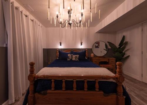 a bedroom with a bed and a chandelier at Magical Themed Decor! Pets Welcome! 3 Bedrooms in Chase
