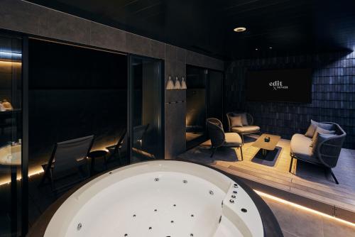 a waiting room with chairs and a bath tub at edit x seven FUJI GOTEMBA in Gotemba