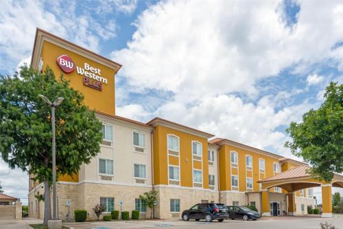 a building with a sign for a hotel at Best Western Plus San Antonio East Inn & Suites in San Antonio