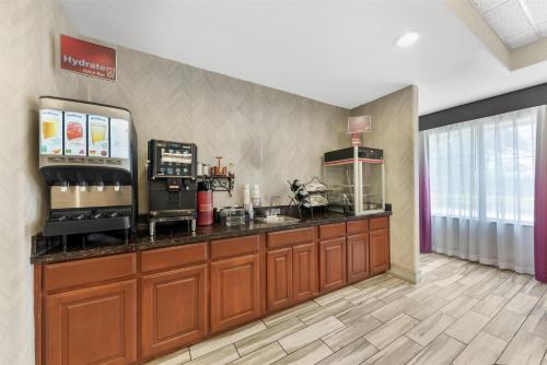a kitchen with a counter with a coffee shop at Best Western Plus San Antonio East Inn & Suites in San Antonio