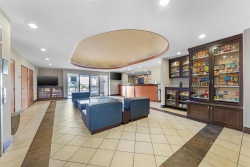 a pharmacy with two blue chairs in a room at Best Western Plus San Antonio East Inn & Suites in San Antonio