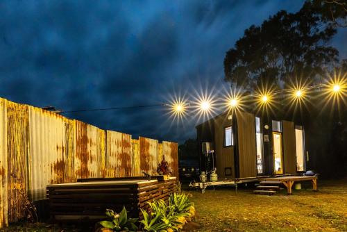 a tiny house with lights on top of it at Wallaby by Tiny Away in Thoopara