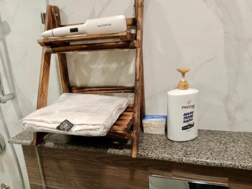 a mattress sitting on a counter next to a bottle of fluid at Elysium Tower Premium Serviced Apartments Facing Centaurus Mall Islamabad in Islamabad