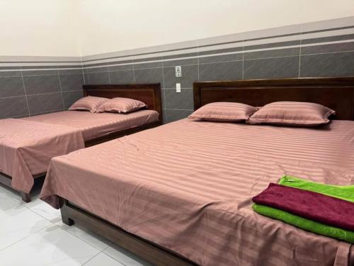 Cama o camas de una habitación en Triệu Vy Homestay