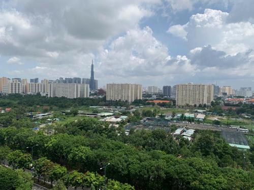 a view of a city with tall buildings and trees at The Sun Avenue Serviced Apartment in Ho Chi Minh City