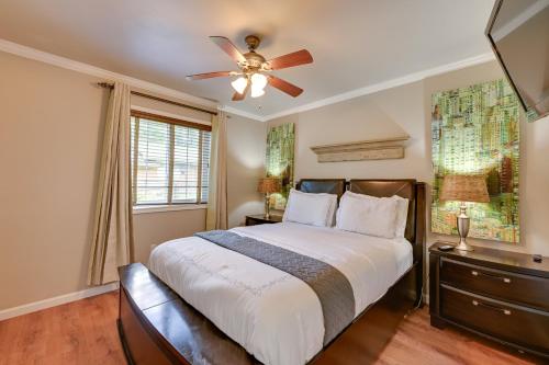 a bedroom with a bed and a ceiling fan at The Homestead Apartments- Walk to SFA Campus, Comfy, Children & Pet-Friendly Nacogdoches Condo in Nacogdoches