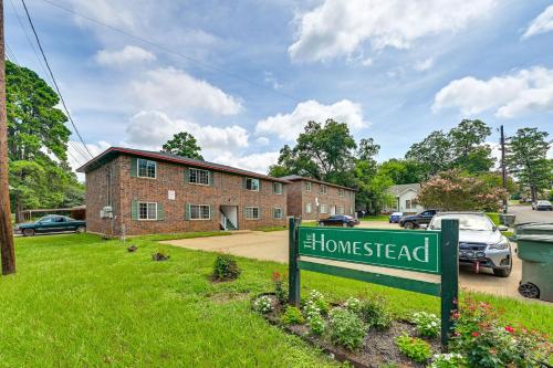 a house with a sign in front of it at The Homestead Apartments- Walk to SFA Campus, Comfy, Children & Pet-Friendly Nacogdoches Condo in Nacogdoches
