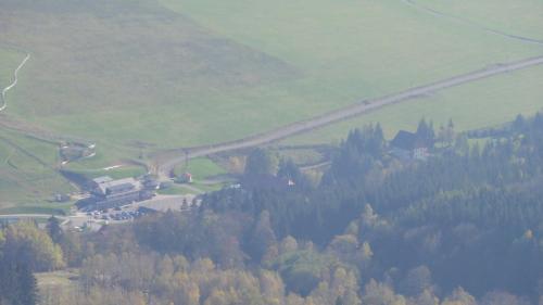 an aerial view of a winding road in a mountain at HORSKÁ CHATA SOBÍK in Dolní Morava