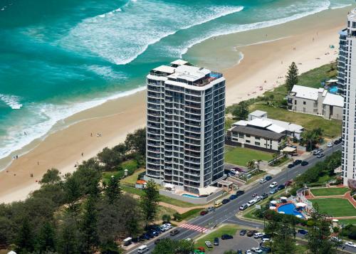 an aerial view of a building next to a beach at Golden Sands on the Beach - Absolute Beachfront Apartments in Gold Coast
