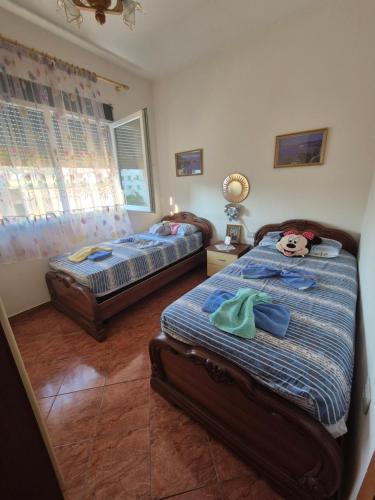 Ένα ή περισσότερα κρεβάτια σε δωμάτιο στο Accogliente casa nel centro storico di Valona