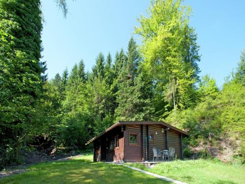 a small cabin in the middle of a forest at Chalet in Wörgl near SkiWelt Wilder Kaiser in Salvenberg
