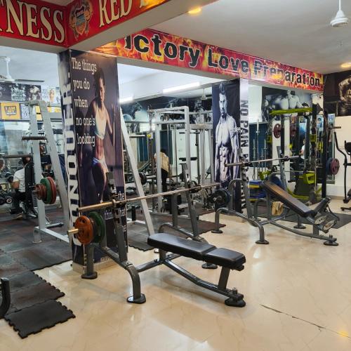a gym with a bunch of equipment in a room at Hotel Times Stay in Udaipur