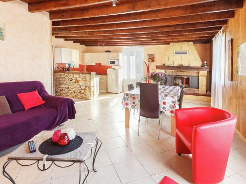 a living room with a couch and a table at Dordogne Family Haven in Orliac