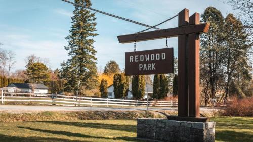a sign for a neighborhood park on a street at The Sunset Haven- Cozy 2BR Basement Suite near White rock in Surrey