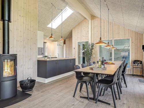 a kitchen and dining room with a table and chairs at 5 star holiday home in Kappeln in Kappeln