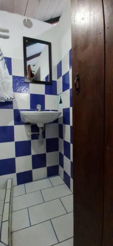 a bathroom with a sink and a mirror at BlueBayou.capurgana in Capurganá