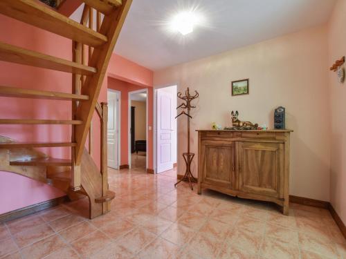 a hallway with a staircase in a house at Holiday home with private garden in Cazals