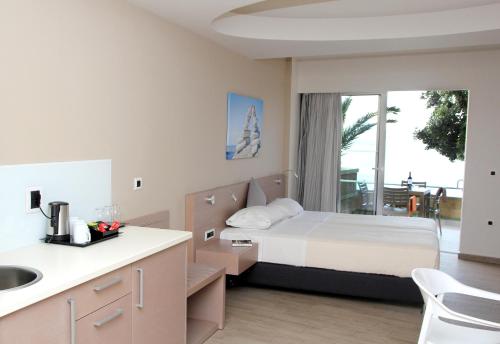 Cama o camas de una habitación en Renieris Hotel