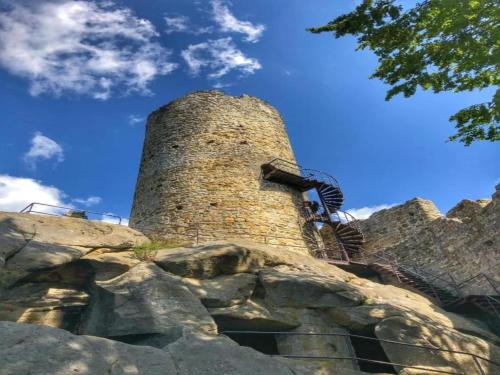 a tall brick tower on top of a mountain at Tranquil North Bohemia Getaway in Prachov