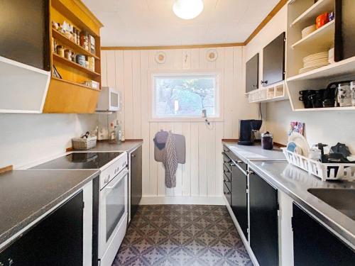 a kitchen with stainless steel appliances and a window at 6 person holiday home in FIGEHOLM-By Traum in Figeholm
