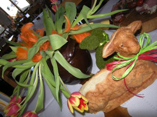 a table topped with a toy animal and a plant at Dwa Dęby in Lubawka