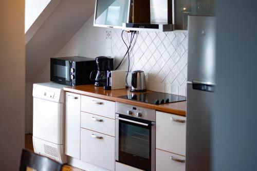 Kuchyň nebo kuchyňský kout v ubytování LOFT COSY SUR MER