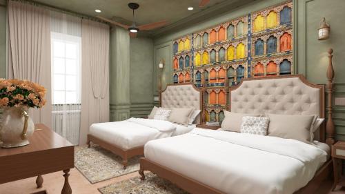 a bedroom with two beds and a painting on the wall at Shri Ram Paying Guest House Premium Rooms in Varanasi