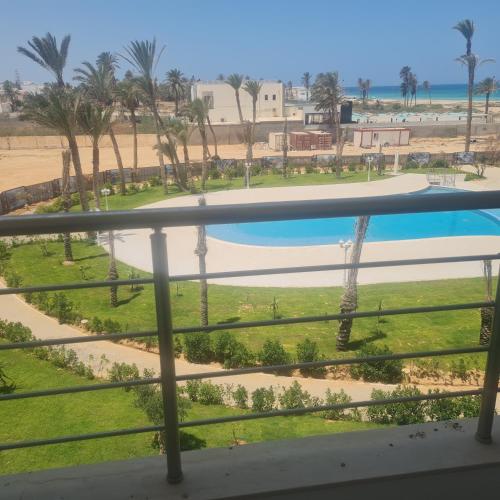 a view from the balcony of a resort with a swimming pool at Diar el bahar zarzis sonia marina in Zarzis