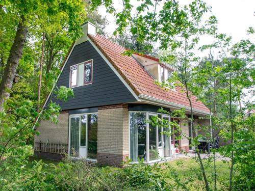 a small house with a red roof at Holiday Home in Lemele near Nature Reserve in Lemele